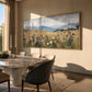 Meadow Distance painting beside a dining table and dark upholstered chairs.