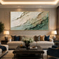Verdant Layers painting above a sofa with green and gold cushions.
