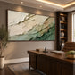 Verdant Layers painting above a wooden desk in a warm study.