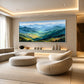 Sunlit Ridges painting above curved cream lounge chairs.