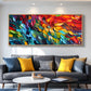 Prismatic Rhythm painting above a gray sofa with yellow cushions.