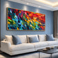 Prismatic Rhythm painting above a cream sofa.