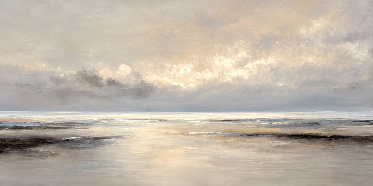 Soft golden light breaks through a veil of gray clouds above a quiet shoreline. Full 2:1 artwork without a frame.