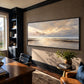Quiet Tide painting above lounge seating beside bookshelves.