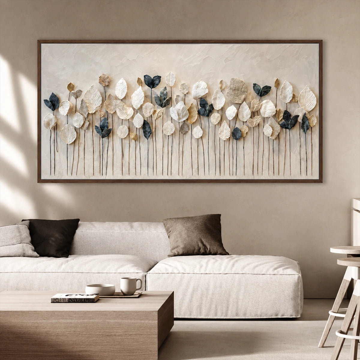 Quiet Foliage botanical painting above a pale sectional and wooden coffee table.