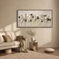 Quiet Foliage botanical painting above a sofa with olive cushions and a small side table.