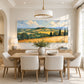 Golden Hills painting above a dining table with cream chairs.