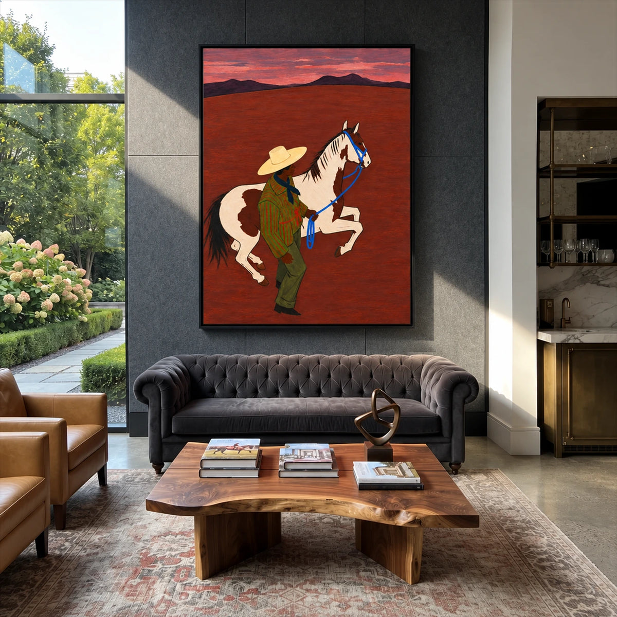 Crimson Reins painting above a leather sofa on a dark accent wall.