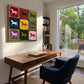 Chromatic Horses painting above a desk beside a blue chair.