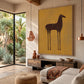 Ochre Steed painting above a rustic console beside tropical plants.
