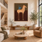 Copper Horseman painting above a low console beside a rounded sofa.