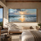 Sunset Shore painting above a low console beside a bed.