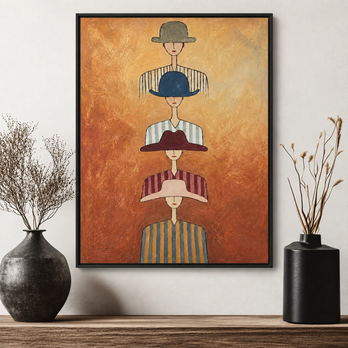 Hat Parade artwork displayed above a pale console between dark vases and dried branches.