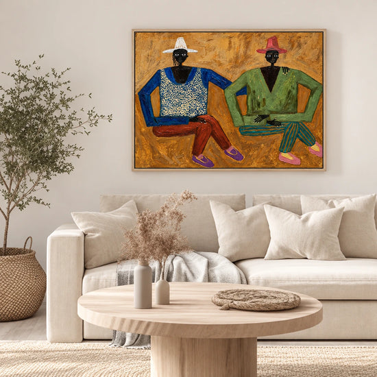 Ochre Companions artwork in a natural wood frame, displayed in a furnished interior (interior view 2).