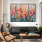Bloom Tapestry artwork in a black frame, displayed in a furnished interior (interior view 1).