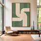 Sage Rhythm artwork displayed above a long low bookcase beside a lounge chair and tall windows.