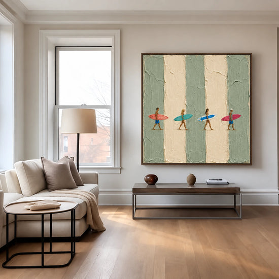 Surf Quartet artwork displayed above a low bench beside pale seating and tall windows.