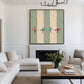 Surf Quartet artwork displayed above a dark fireplace in a white living room.