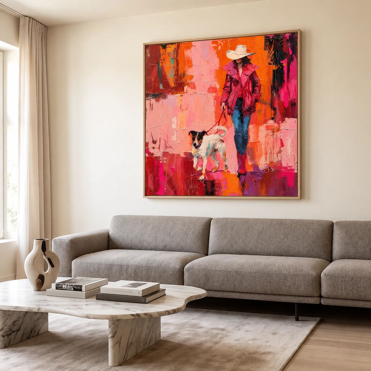 Scarlet Stroll artwork displayed above a gray sofa and a pale stone coffee table.