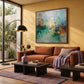 Mistbound Light artwork displayed above a rust sofa beside a sunlit window.