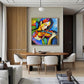 Chromatic Strings artwork displayed above a dining table in a wood-accented room.