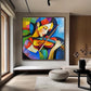 Chromatic Strings artwork displayed above a pale bench beside tall windows.