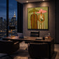 Olive Vows artwork displayed above a desk overlooking a city skyline.