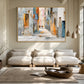 Sunlit Passage artwork displayed above pale seating and a round wooden coffee table.