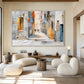 Sunlit Passage artwork displayed above pale curved chairs and a dark sideboard.