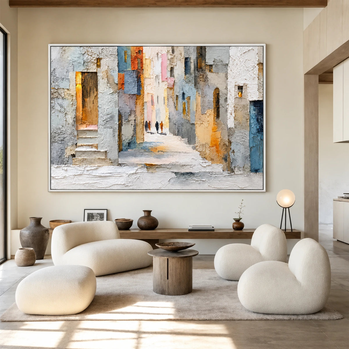 Sunlit Passage artwork displayed above pale curved chairs and a dark sideboard.