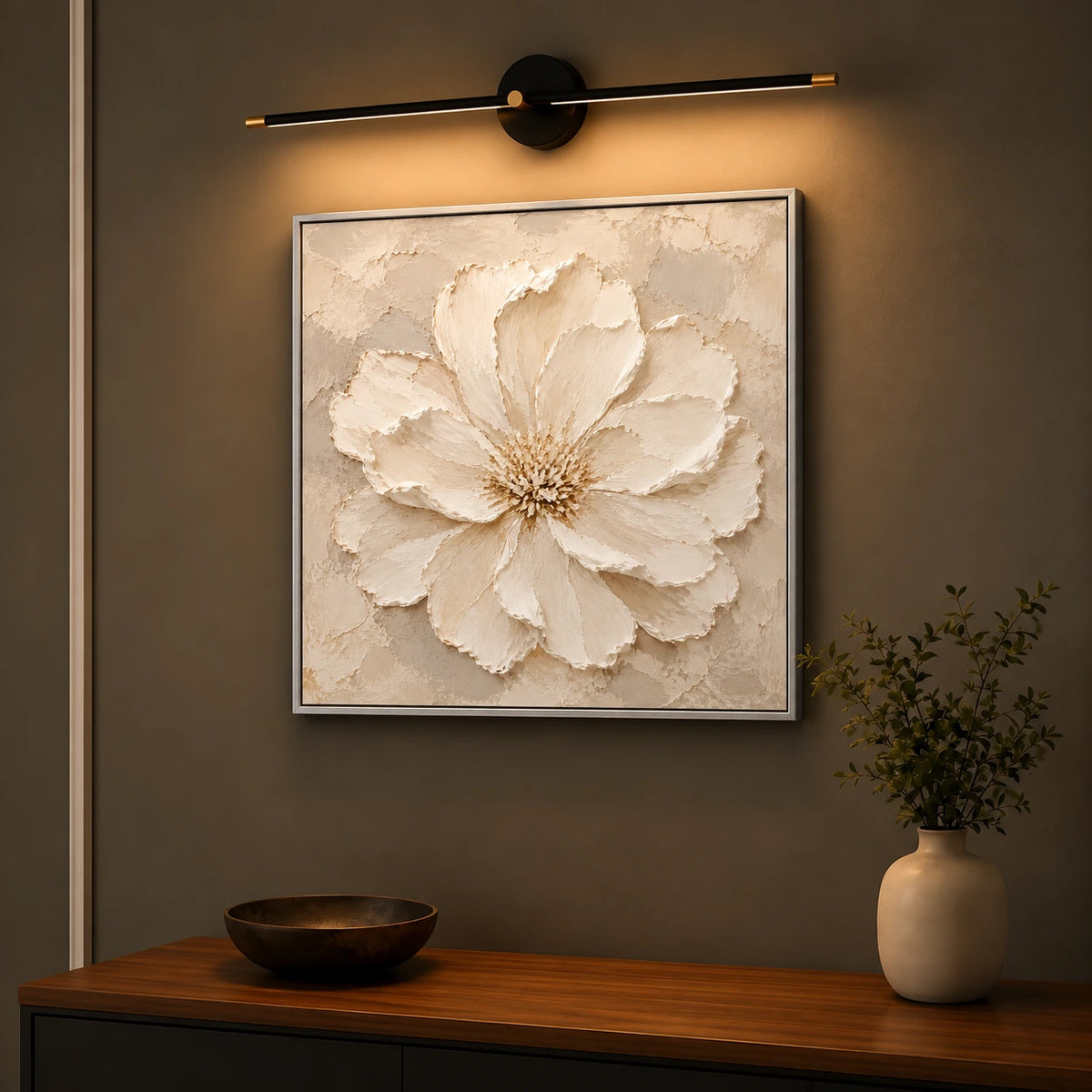 Petal Relief artwork displayed above a wooden console beneath a picture light.