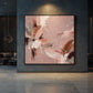 Blush Reverie artwork displayed on a dark blue wall above a pale stone floor.
