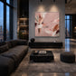 Blush Reverie artwork displayed above a low wooden cabinet in a dark sitting room.