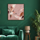 Blush Reverie artwork displayed on a green wall beside an upholstered chair.