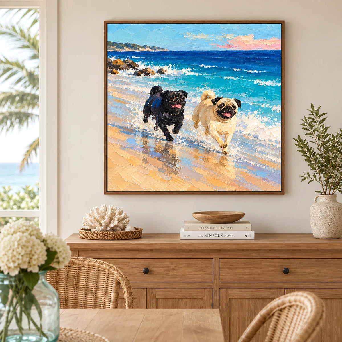 Surf Pals artwork displayed above a wooden sideboard beside woven dining chairs.