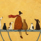 Golden Companions full artwork. A woman in a rust-colored coat and flowing scarf sits among a row of cats and dogs against a golden yellow ground.