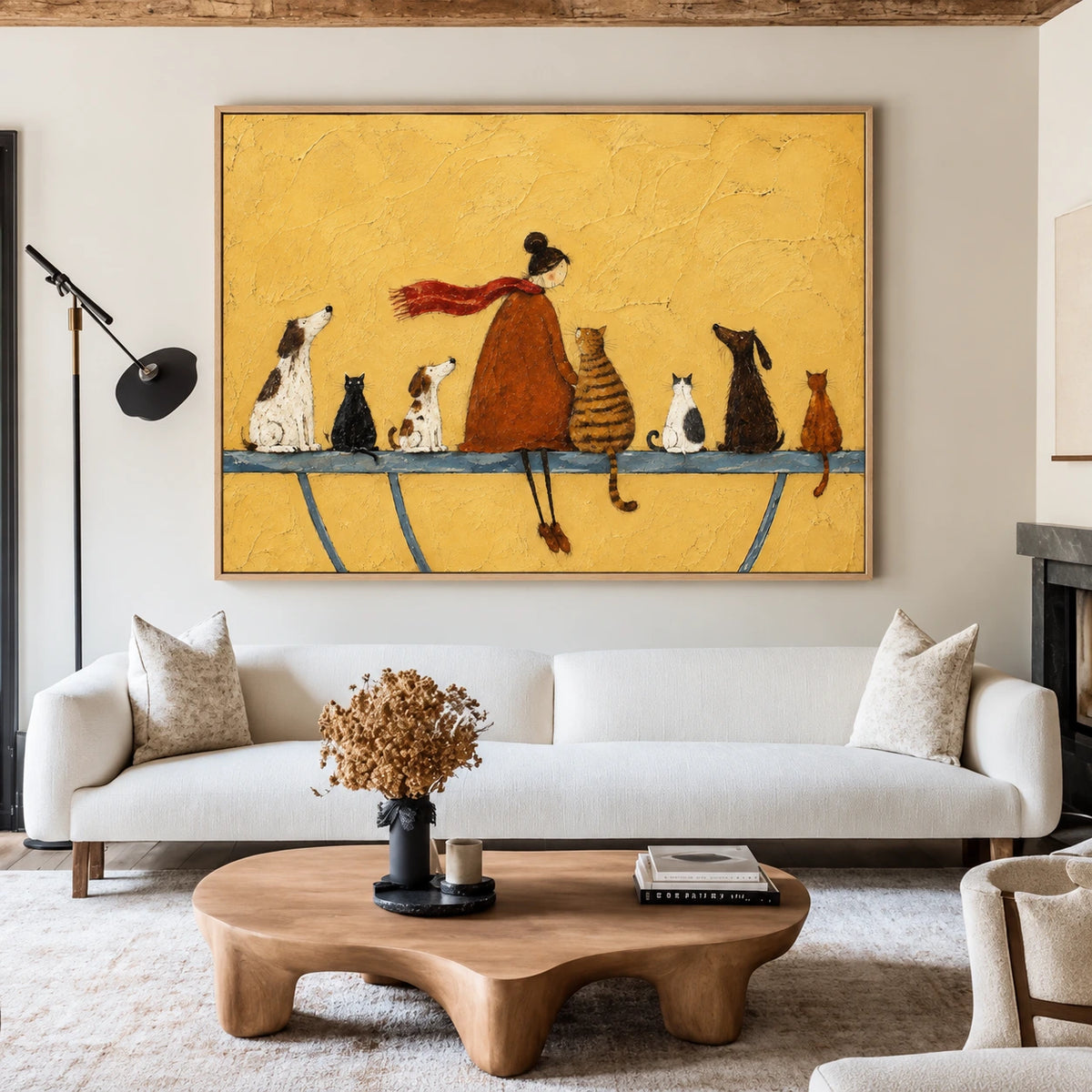 Golden Companions artwork displayed above a white sofa and an organic wooden coffee table.