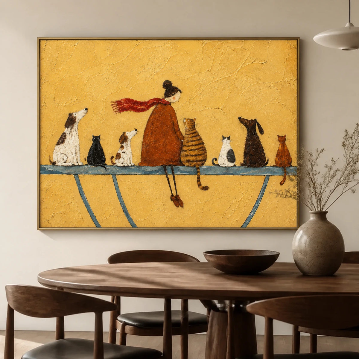 Golden Companions artwork displayed above a wooden dining table beside pale ceramics.