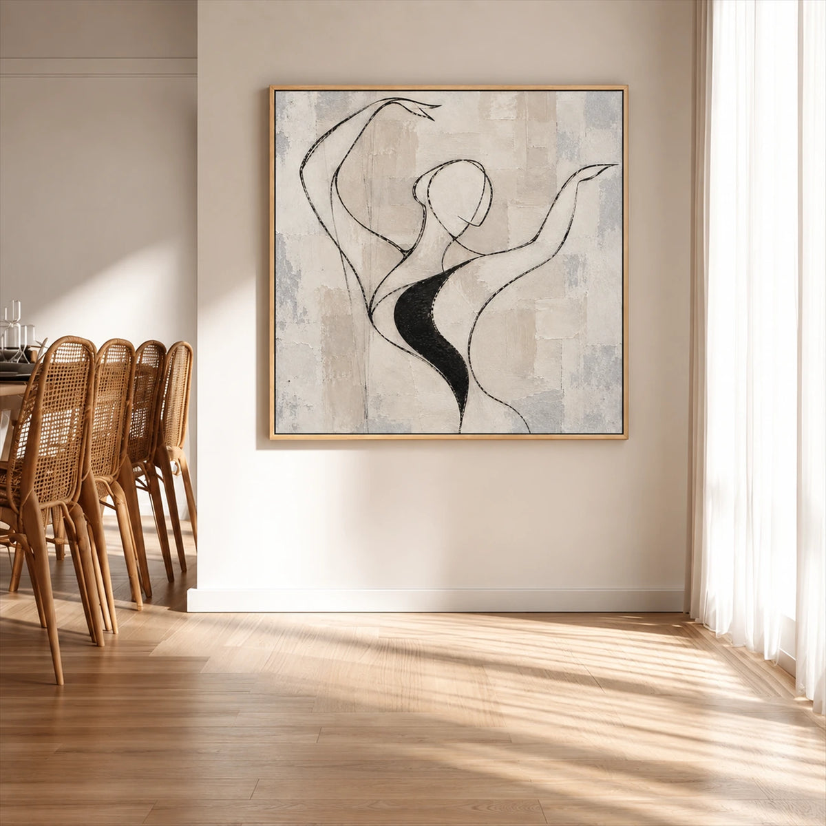 Poised Lines artwork displayed on a sunlit wall beside woven wooden chairs.