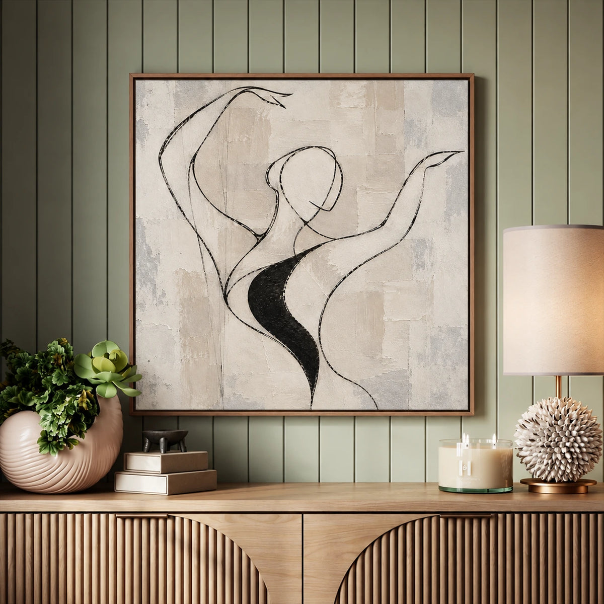 Poised Lines artwork displayed above a wooden sideboard against green wall paneling.