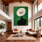 Ivory Brim artwork displayed above a pale sofa in a tall room with exposed wooden beams.