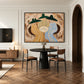Striped Gathering artwork displayed above a round dining table beside an arched doorway.