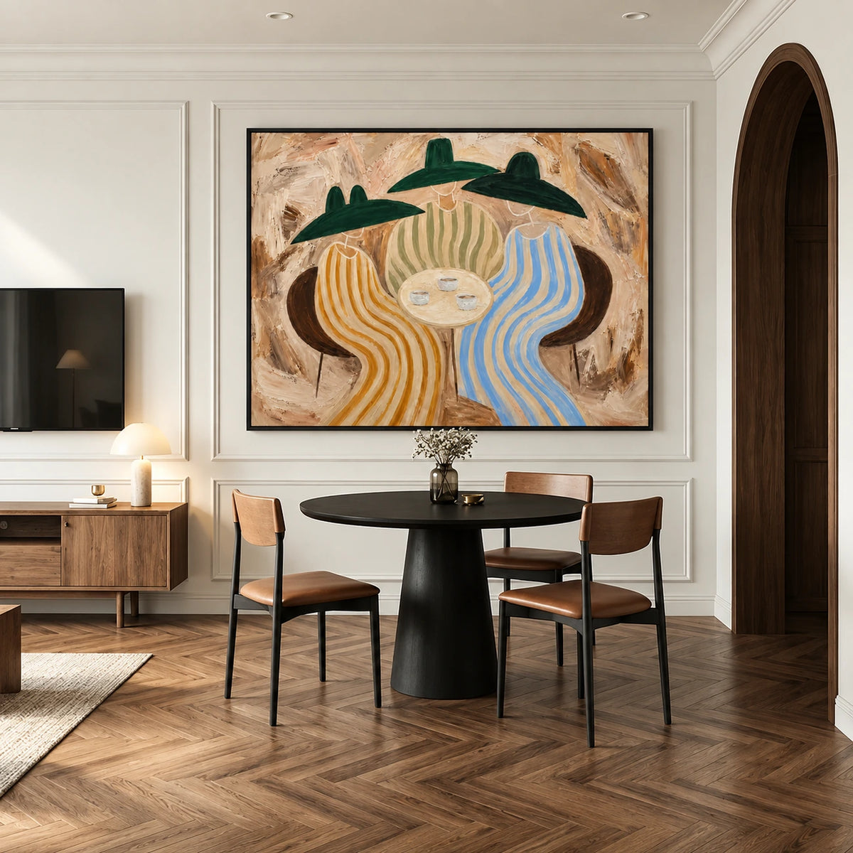Striped Gathering artwork displayed above a round dining table beside an arched doorway.