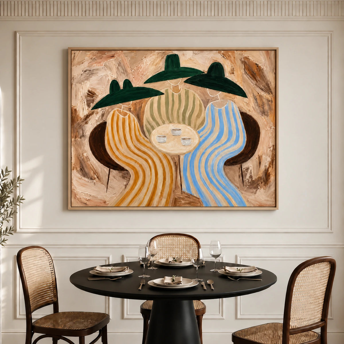 Striped Gathering artwork displayed above a set dining table with woven chairs.