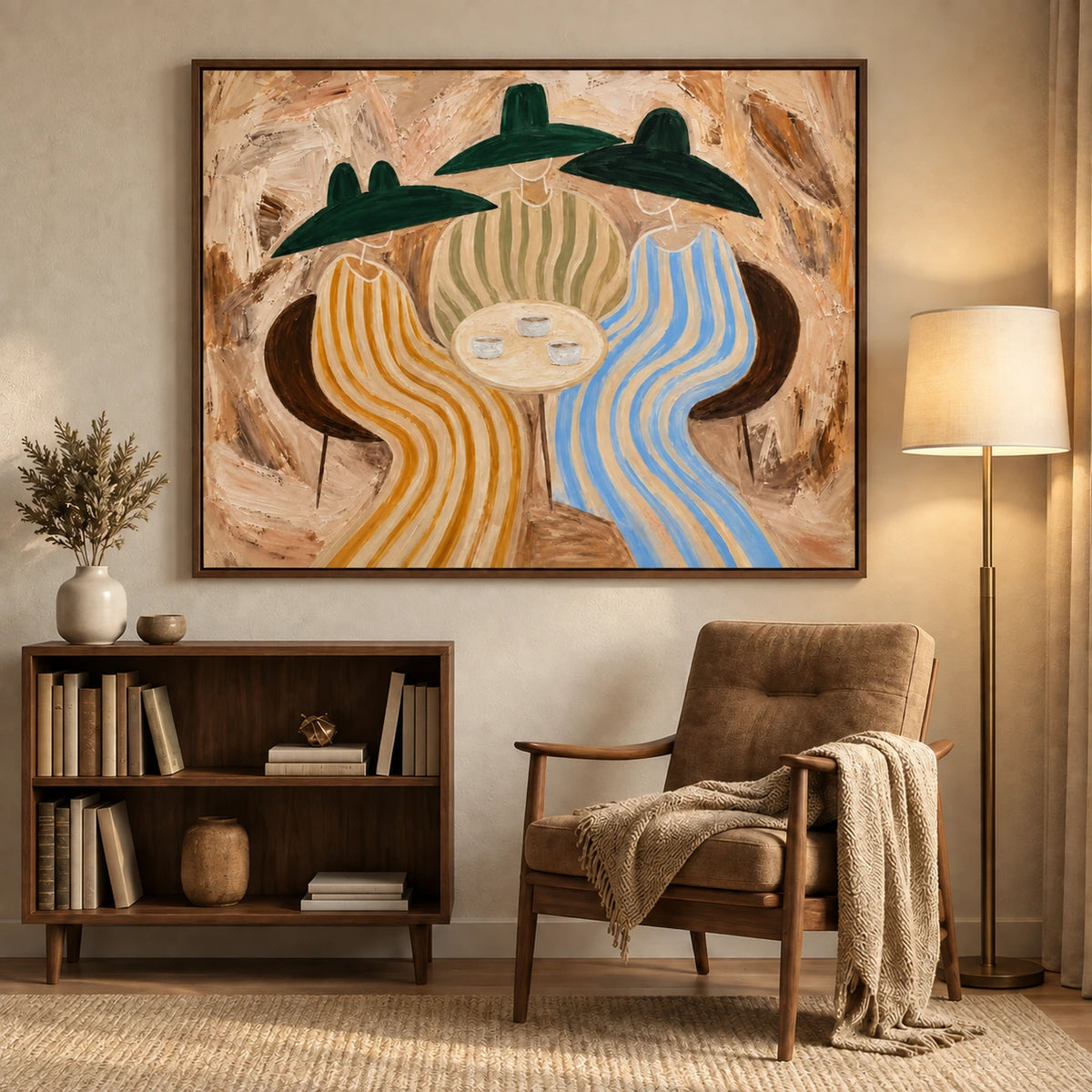 Striped Gathering artwork displayed above a low bookcase beside a lounge chair and floor lamp.