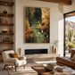 Stillwater Haven artwork displayed above a fireplace beside a pale lounge chair.