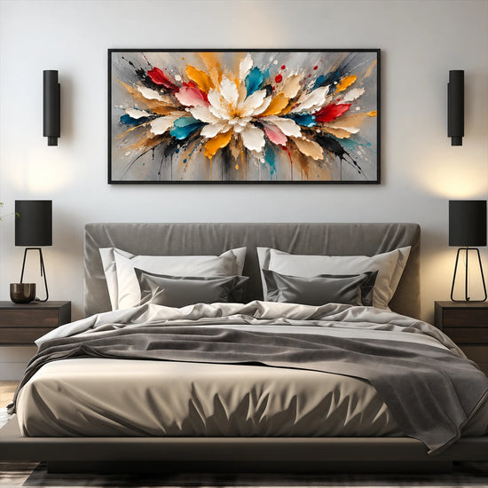 Prismatic Bloom artwork displayed above a gray bed between dark wall lights.