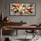 Prismatic Bloom artwork displayed above a wooden desk and dark chair.