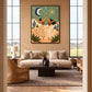 Celestial Dance artwork displayed above a sofa beside tall windows.
