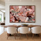 Rose Cadence artwork displayed beside a dining table with upholstered chairs.